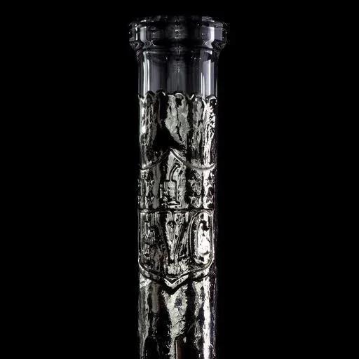 Intricately textured black glass water pipe cylinder against black background
