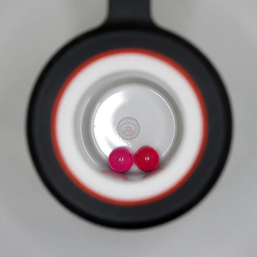Two pink terp pearls inside a quartz banger for dab rig or vaporizer