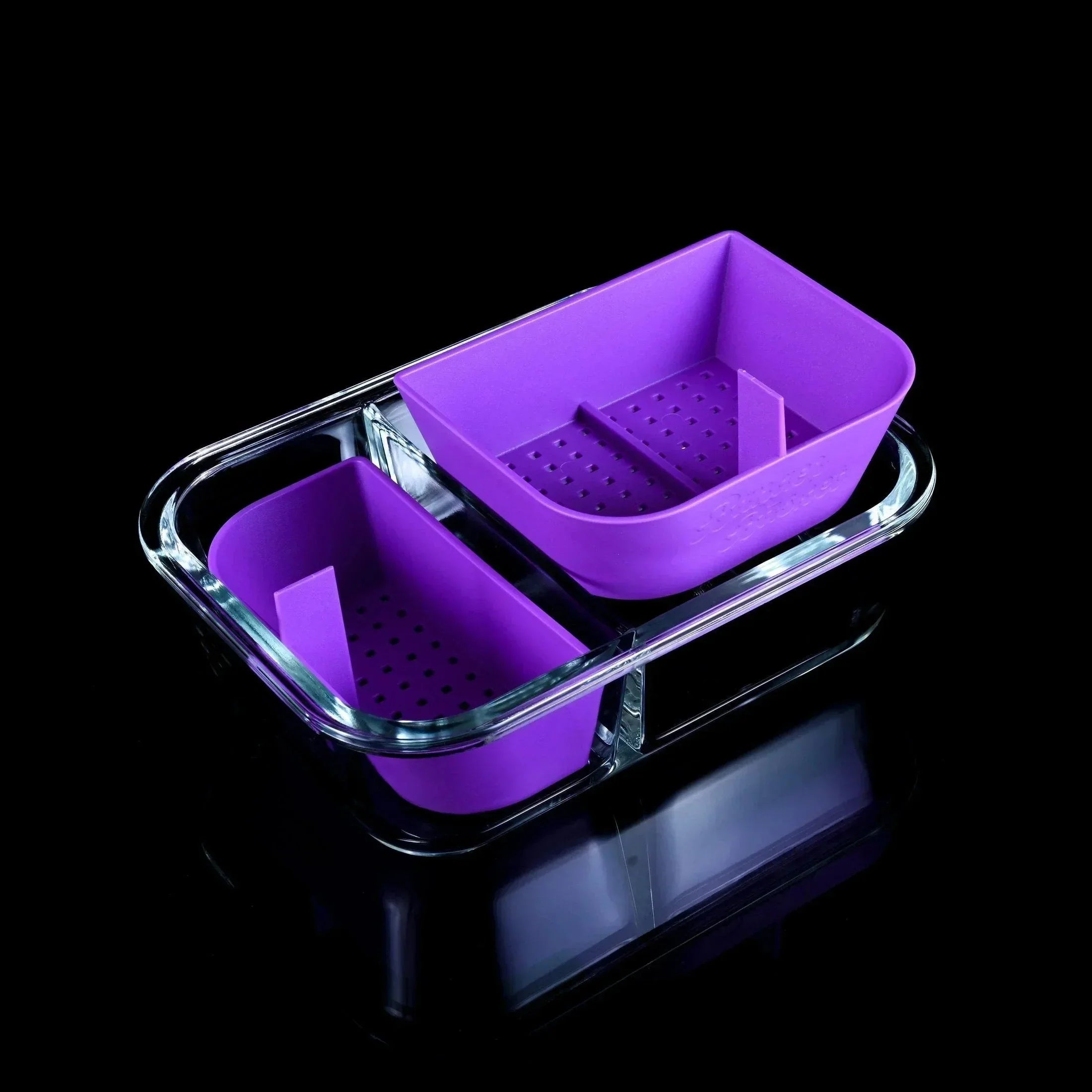 Purple silicone and glass storage tray with two compartments on black background