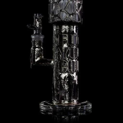 Heady glass water pipe with unique textured design and bold lettering, displayed on black background.