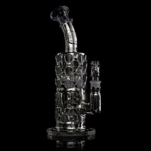 Artistic heady glass water pipe with textured honeycomb design on black background
