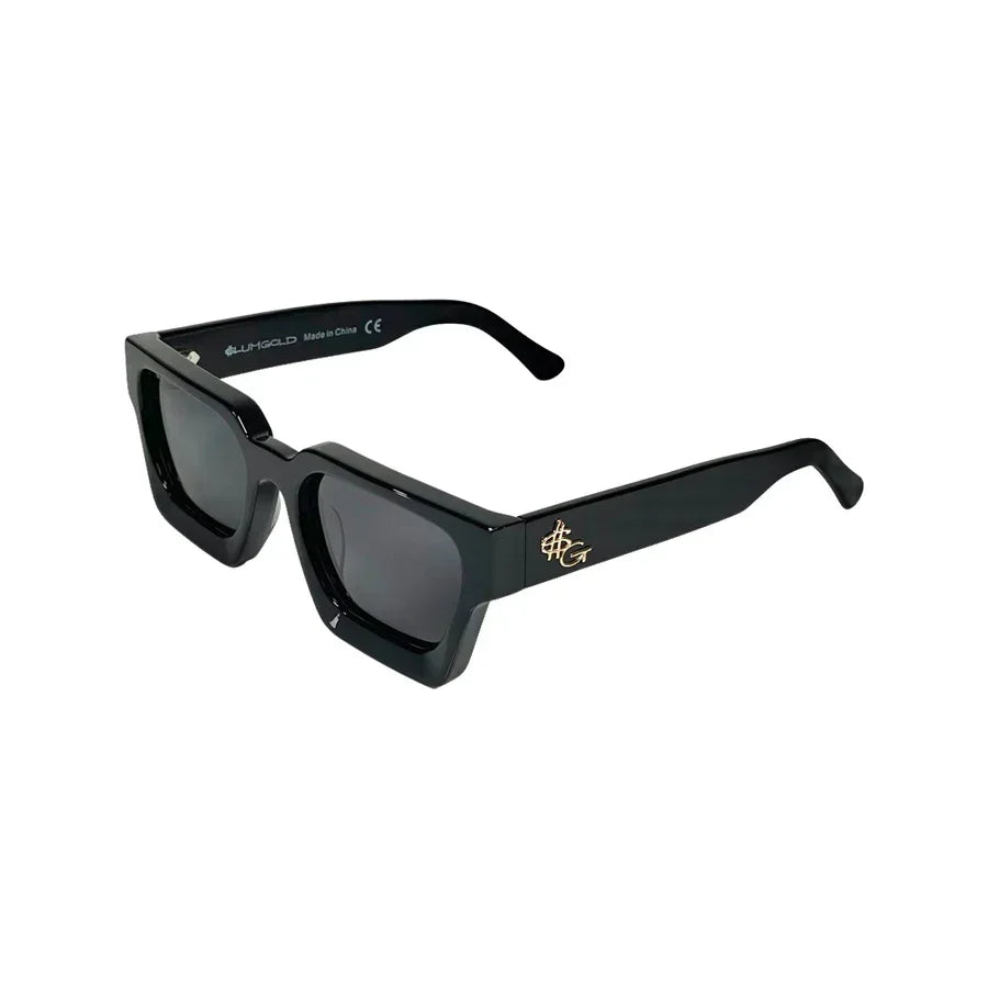 Black rectangular sunglasses with thick frames and gold accent logo on the arms