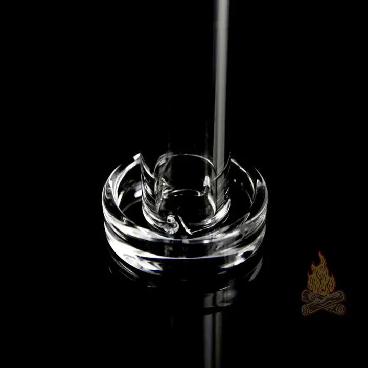Clear glass water pipe base with thick round foot on black background