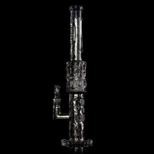 Intricately designed heady glass water pipe with metallic accents on black background