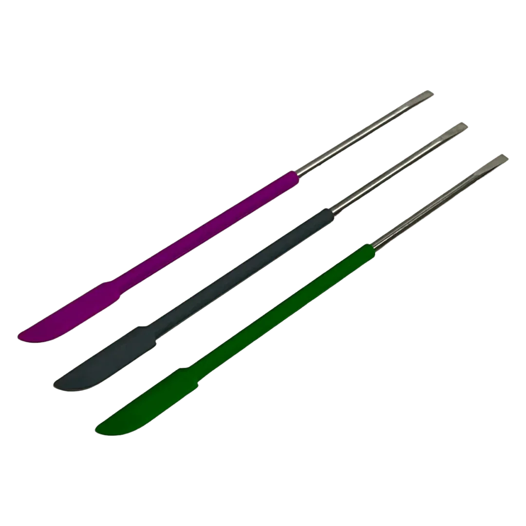 Three silicone and metal dab tools in purple, black, and green on a plain background