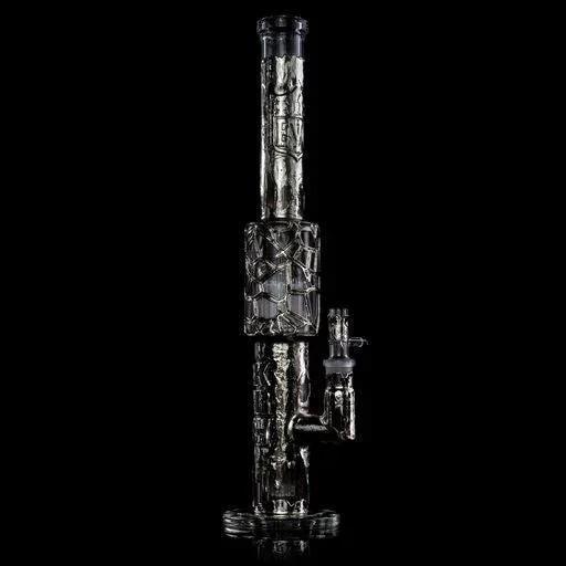 Intricately designed glass water pipe with textured details on a black background