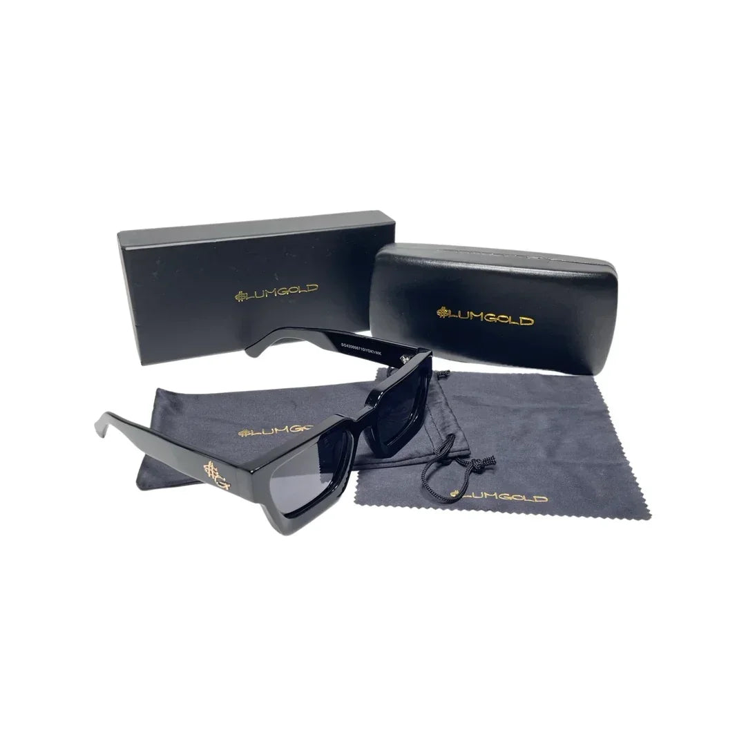 Black designer sunglasses with gold accents, branded case, pouch, and cleaning cloth