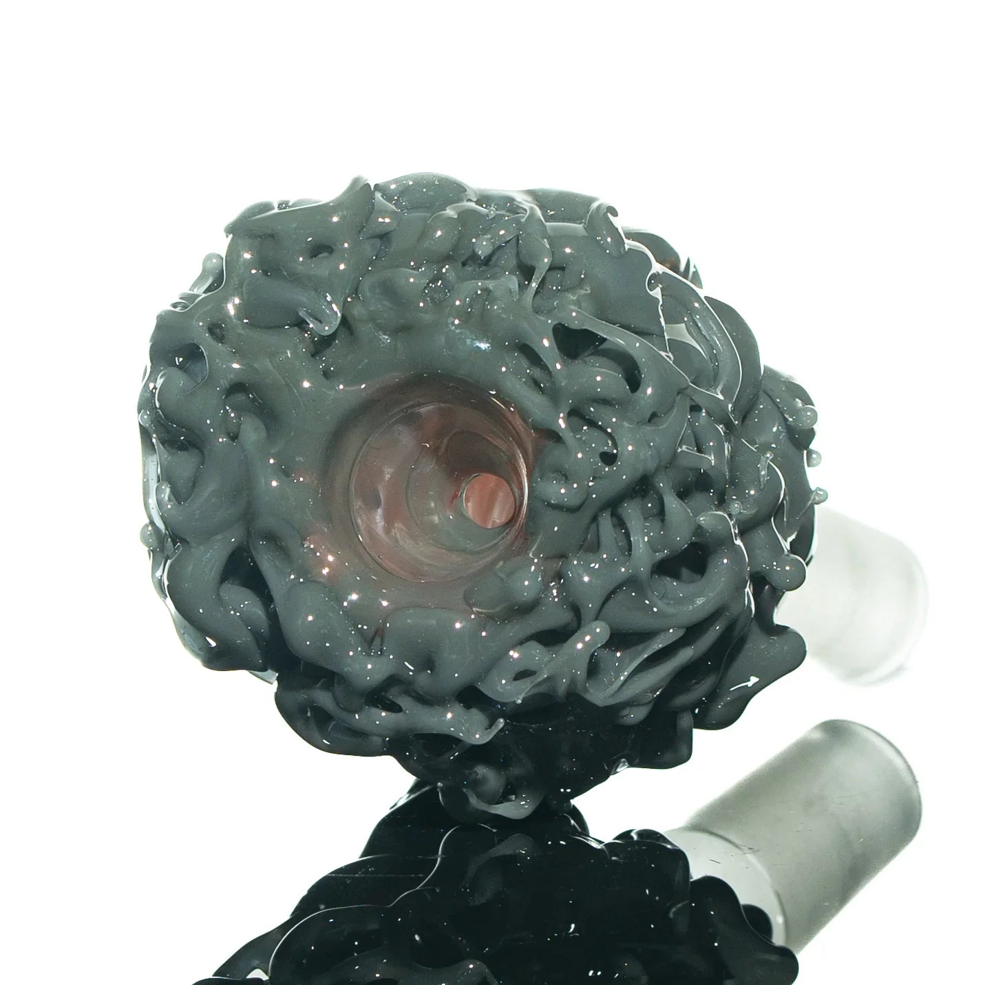 Close-up of intricate gray glass slide accessory with textured, artistic design for water pipes