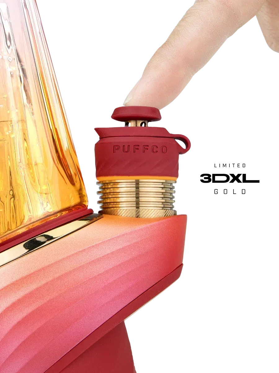 Finger pressing red Puffco joystick carb cap on vaporizer in close-up