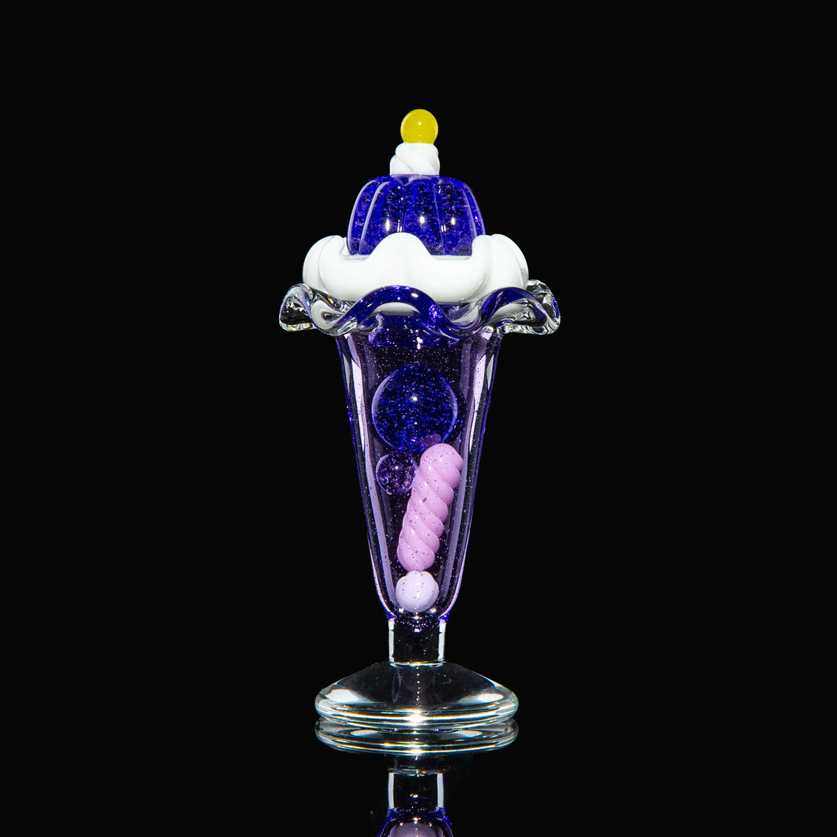 Purple glass sundae-shaped carb cap set with decorative marbles on black background