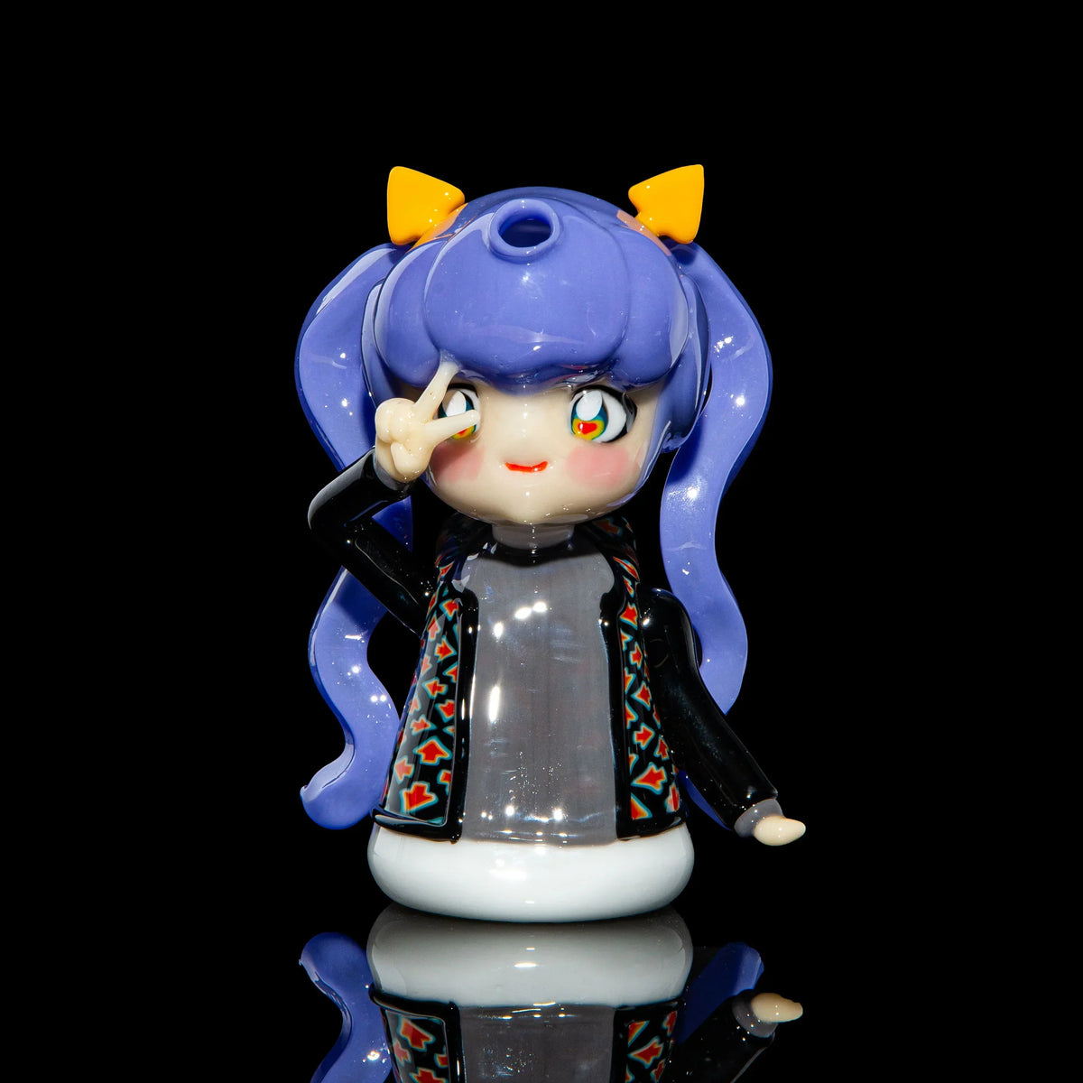 Handcrafted glass water pipe shaped like an anime character with purple hair and peace sign pose