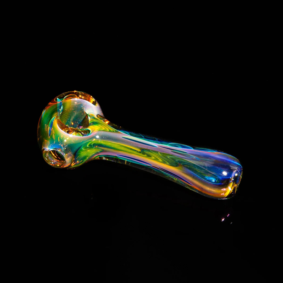 Colorful hand-blown glass smoking pipe with iridescent swirl design on black background