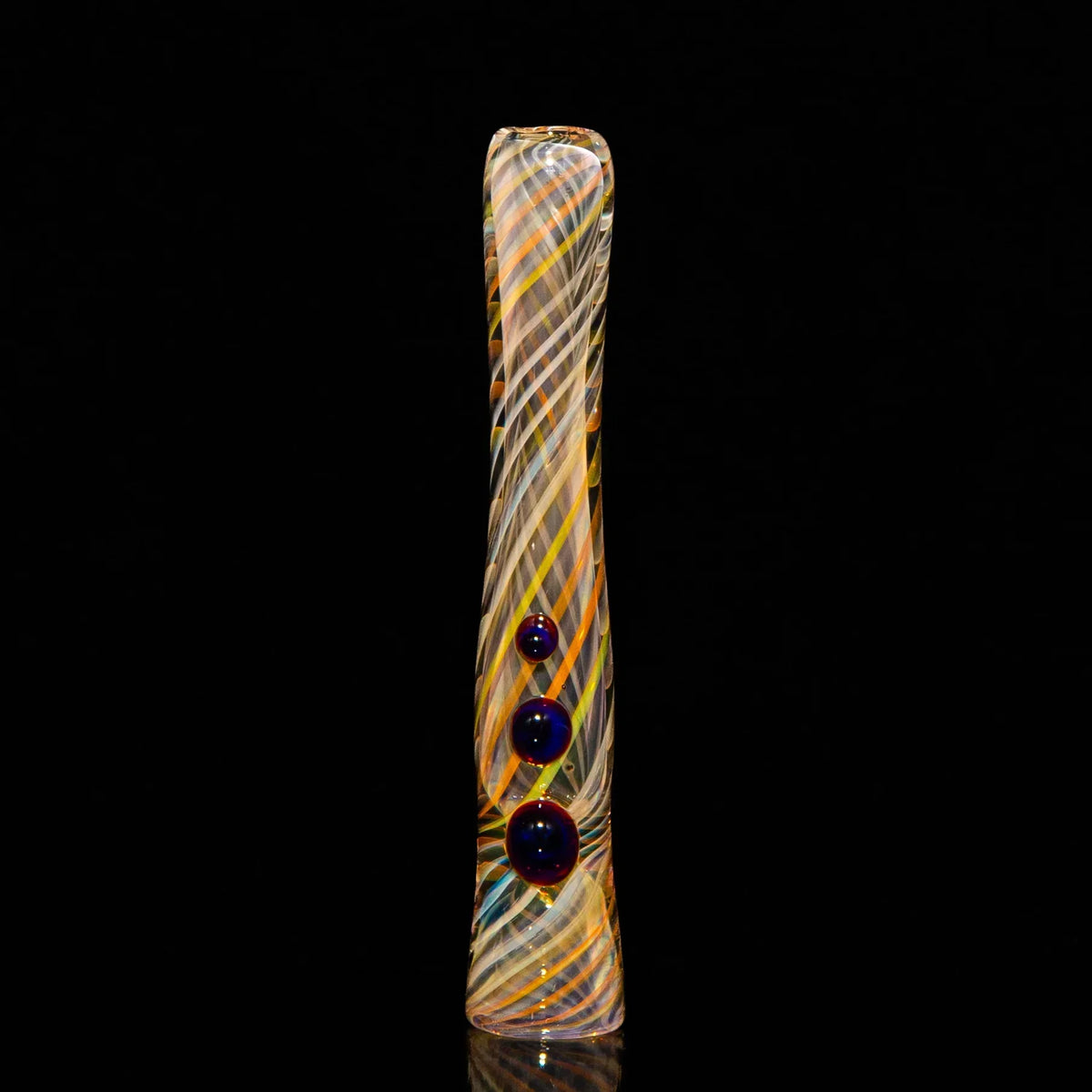 Colorful glass chillum pipe with spiral patterns and three blue marbles, on black background
