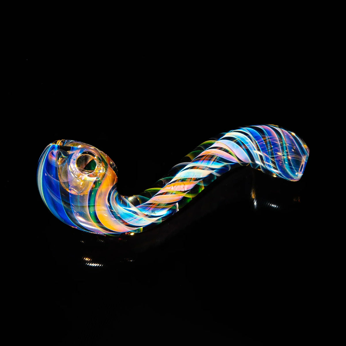 Colorful hand-blown glass smoking pipe with swirling rainbow patterns on black background.