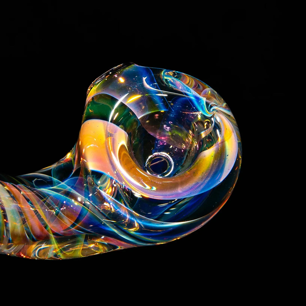 Colorful hand-blown glass pipe with swirled patterns and reflective surface on black background