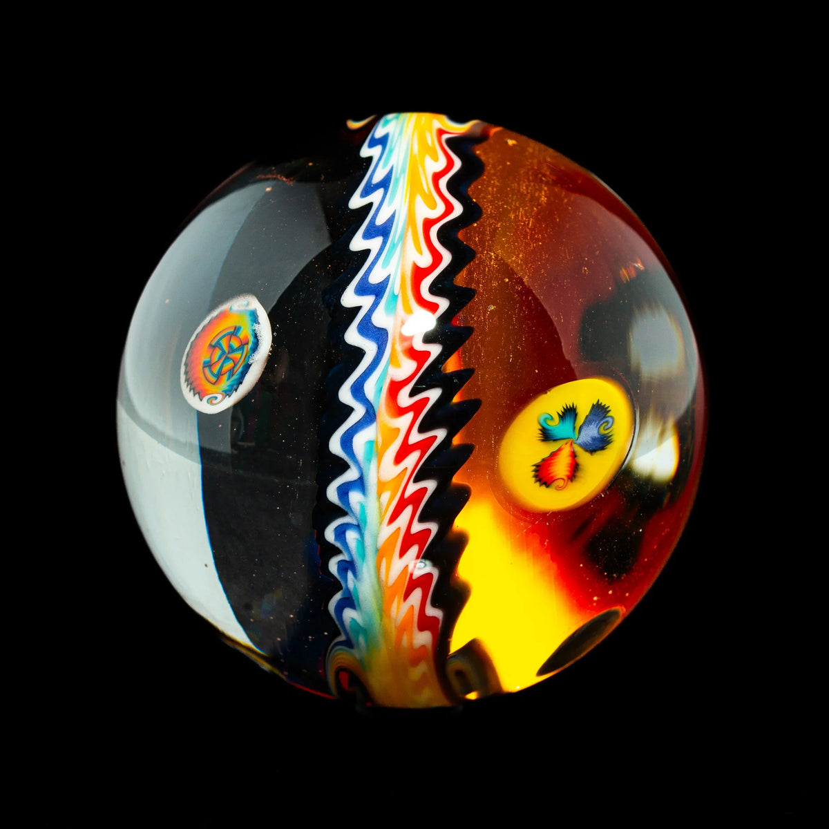Colorful glass marble with rainbow wave pattern and intricate designs on a black background