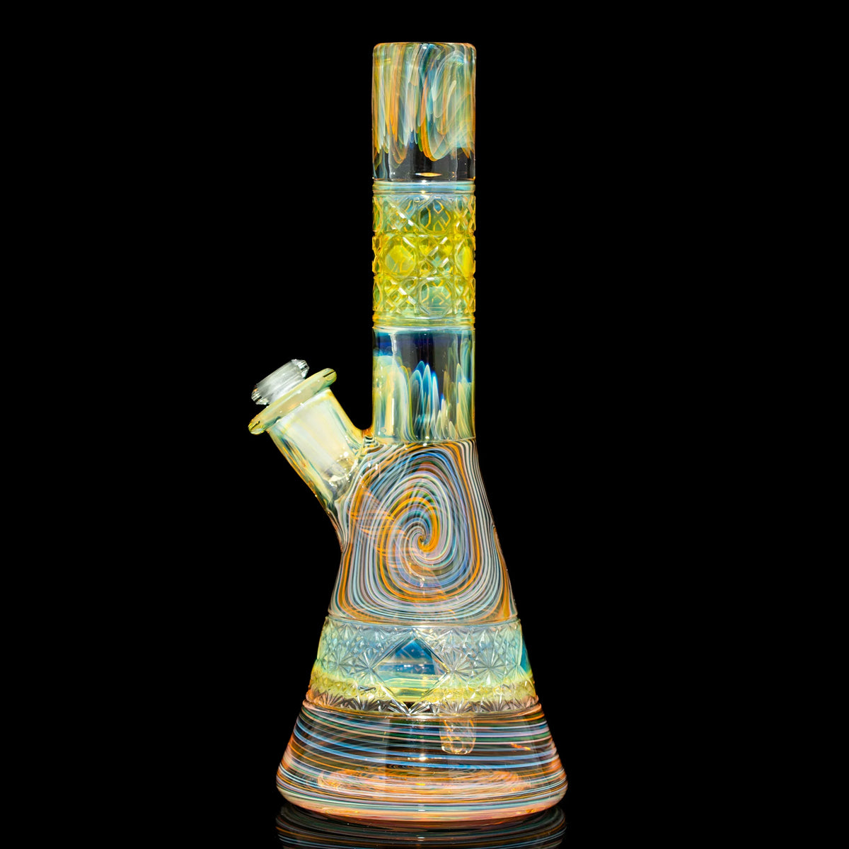 Colorful heady glass water pipe with intricate swirl and geometric designs on black background.