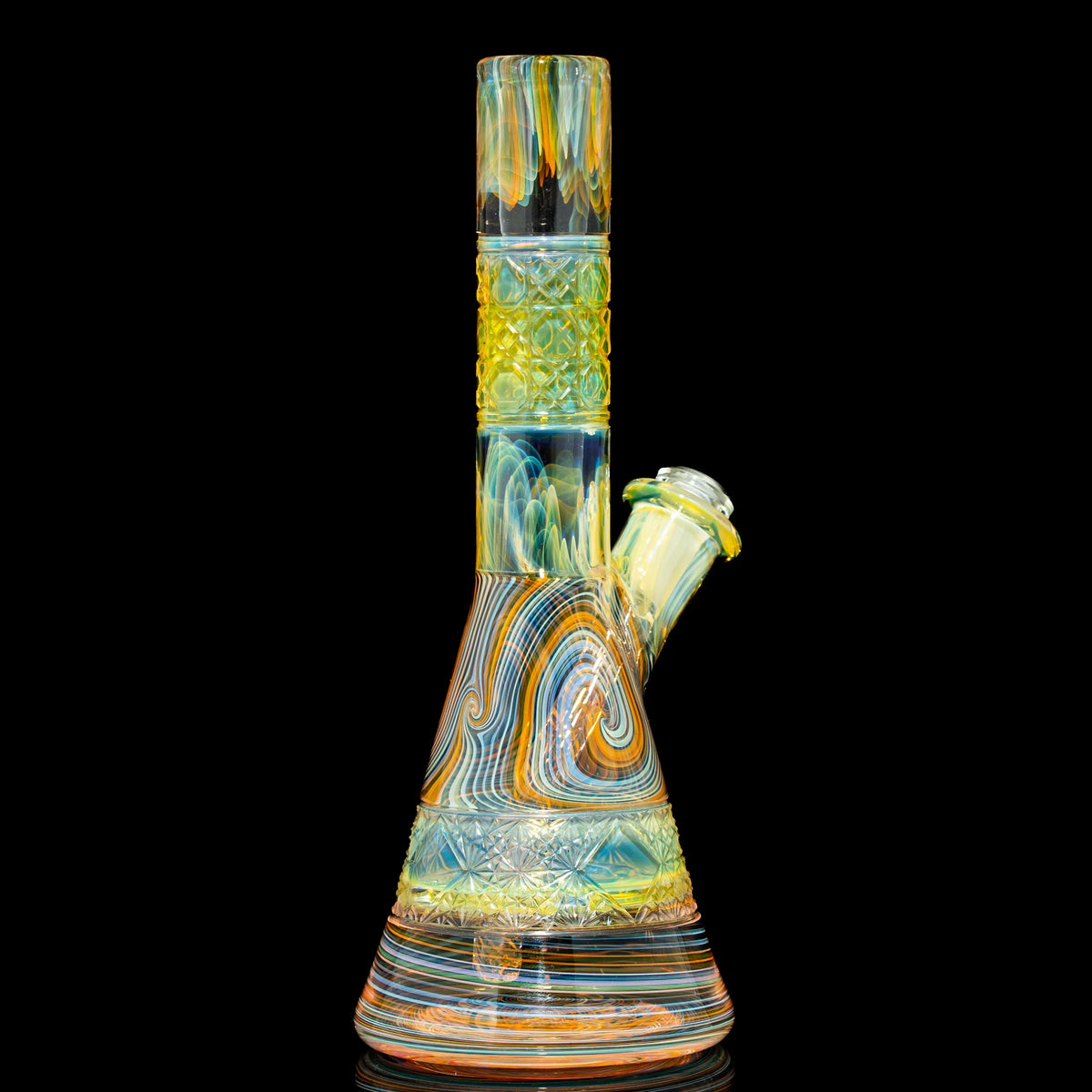 Colorful heady glass water pipe with intricate patterns on black background