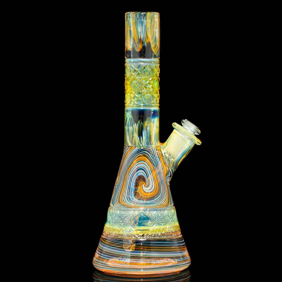 Heady glass beaker bong with colorful swirling patterns and textured design on black background.