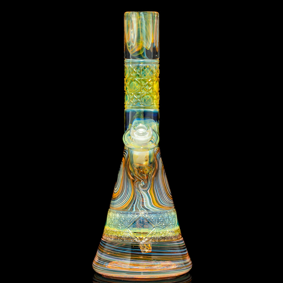 Colorful heady glass beaker bong with intricate swirl and diamond patterns on black background