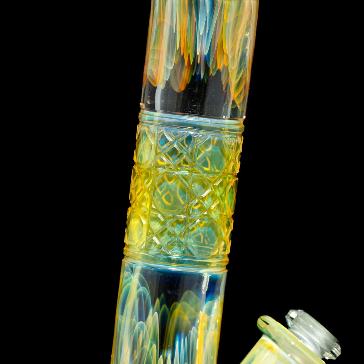 Close-up of colorful heady glass water pipe with intricate patterns and shimmering details