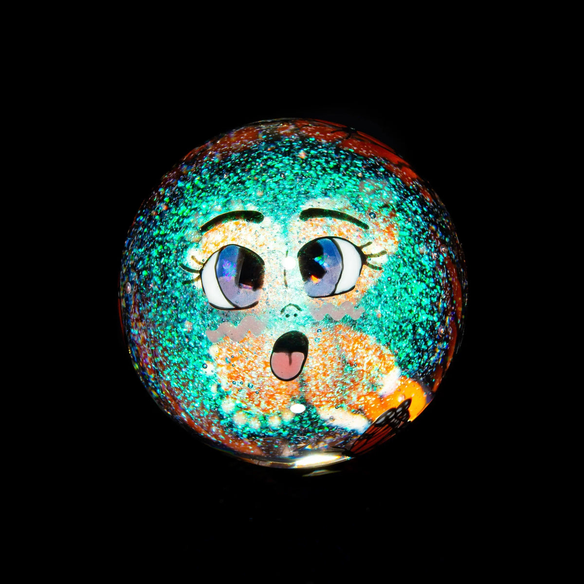 Colorful glass marble with anime-style face, glitter accents, and a black background