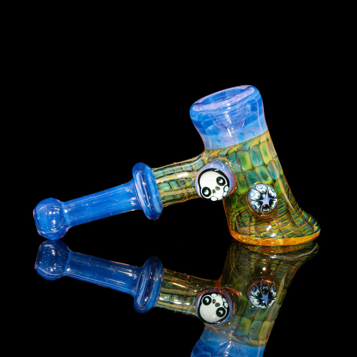 Heady glass hand pipe with blue accents, panda design, and textured details on black background