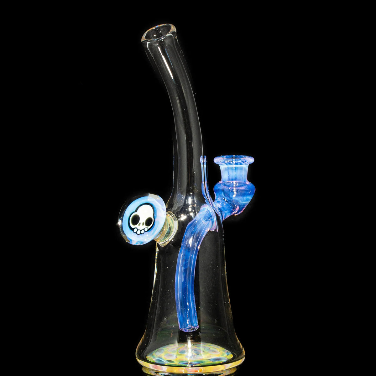 Colorful glass water pipe with blue accents and a skull design on a black background