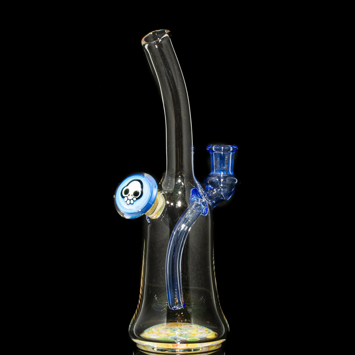 Clear glass water pipe with blue accents and skull design on side, on black background