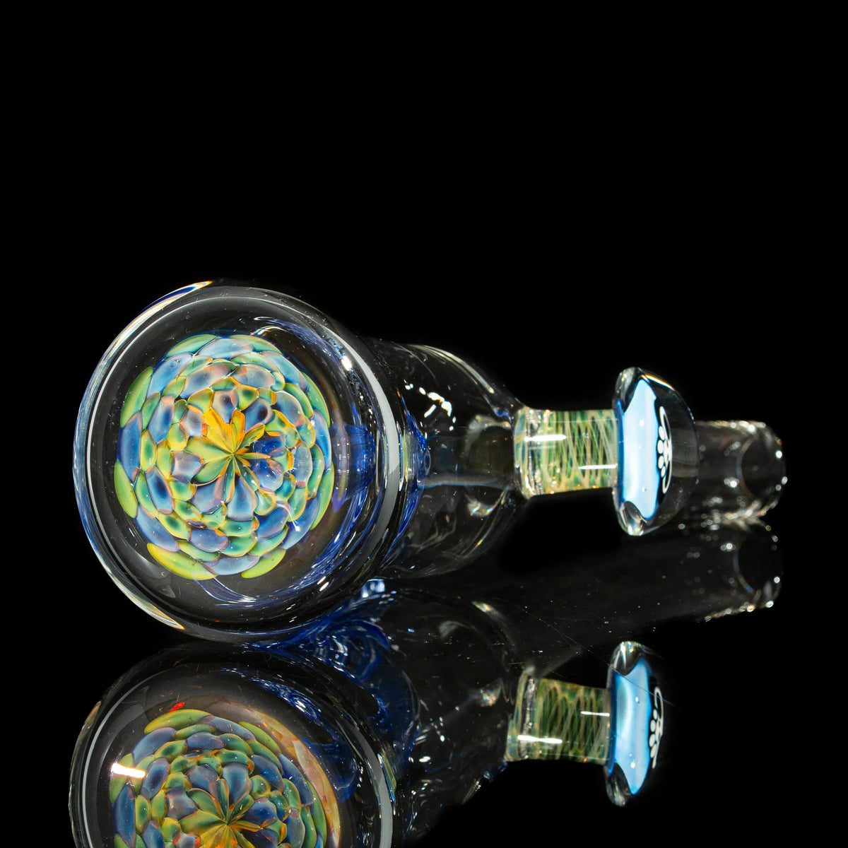 Heady glass pipe with intricate floral pattern and colorful design on a black background
