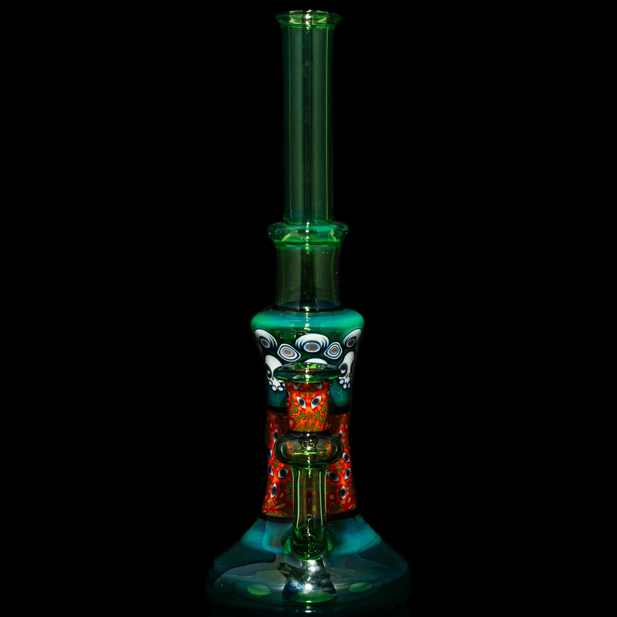 Colorful hand-blown glass water pipe with intricate patterns on a black background