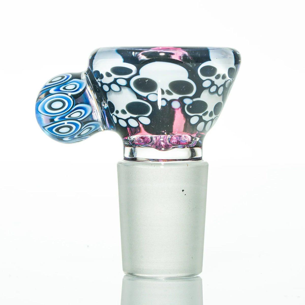 Artistic glass bowl piece with white skull designs and blue accents for water pipes