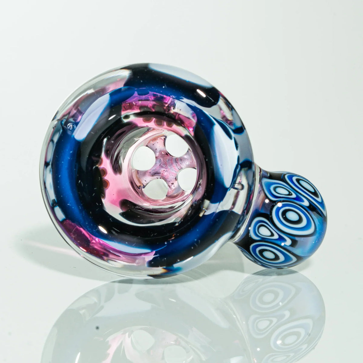 Colorful glass hand pipe with patterned blue accents and multi-hole bowl on white background
