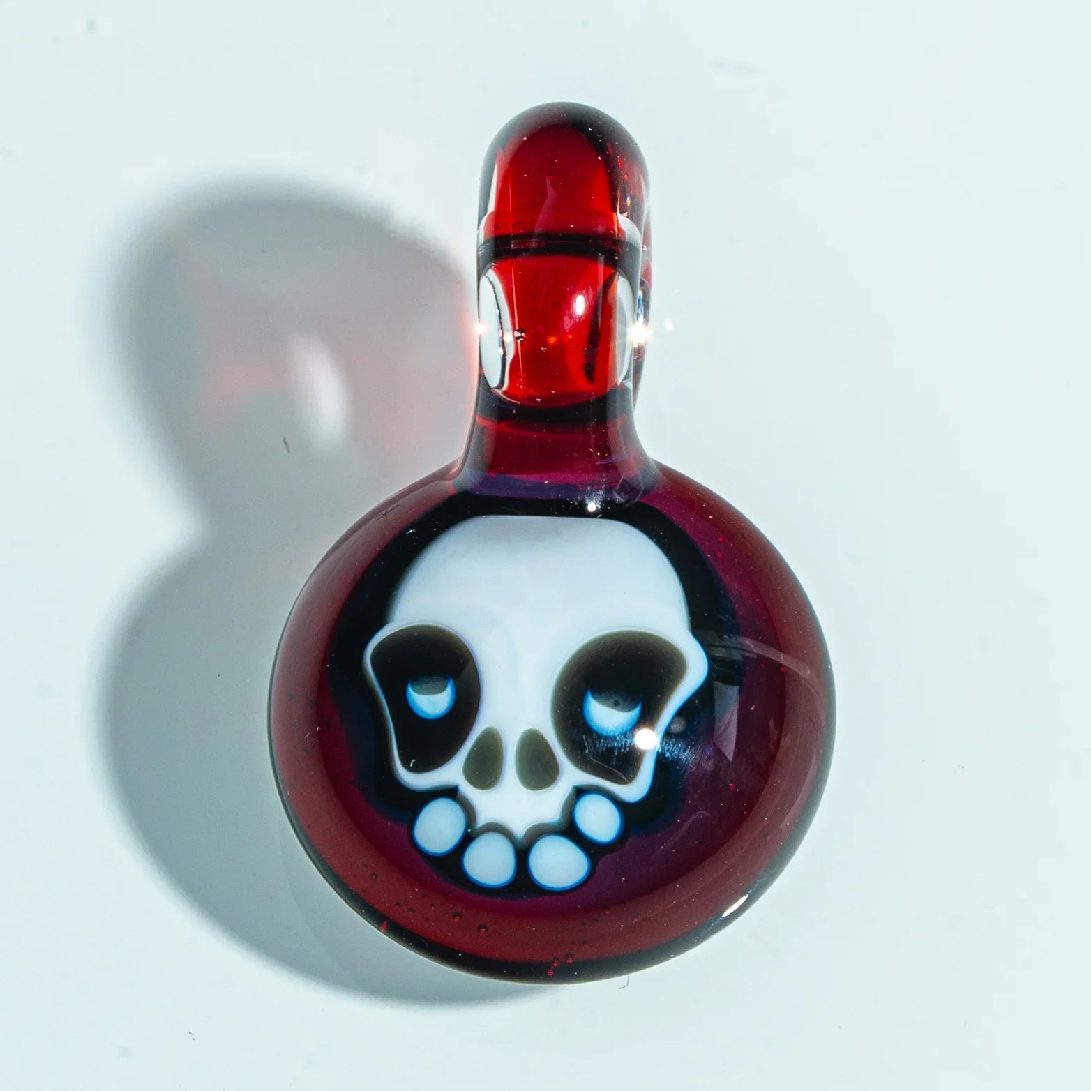 Red glass pendant with skull design, handcrafted art glass accessory