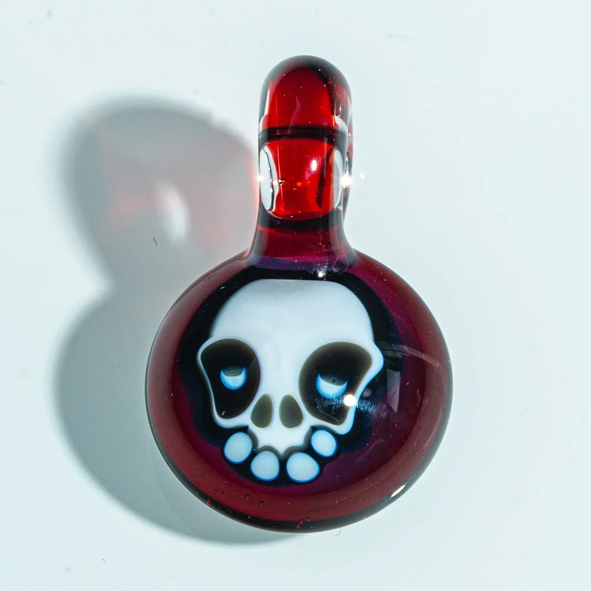 Red glass pendant with skull design, handcrafted art glass accessory