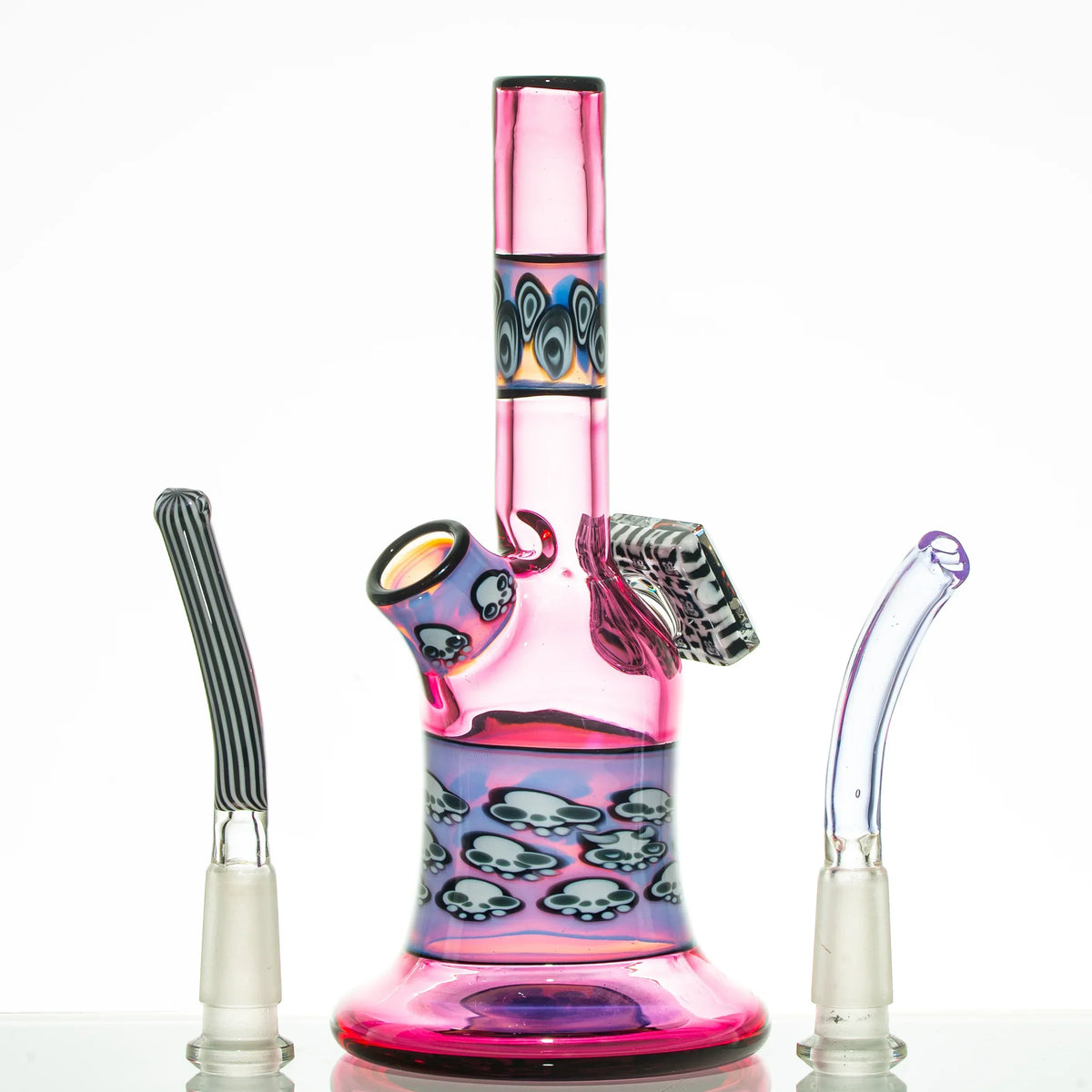 Colorful pink glass water pipe with skull designs and two alternative glass mouthpieces