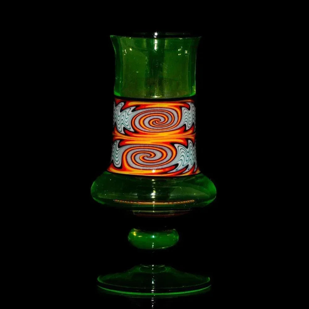 Green heady glass with vibrant orange swirl pattern, artisan smoking accessory