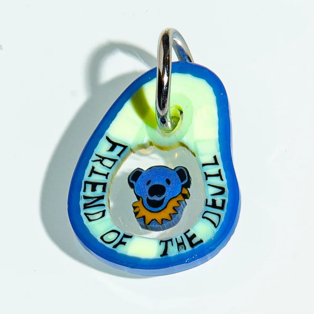 Colorful keychain with blue bear face and 'Friend of the Devil' text, unique accessory
