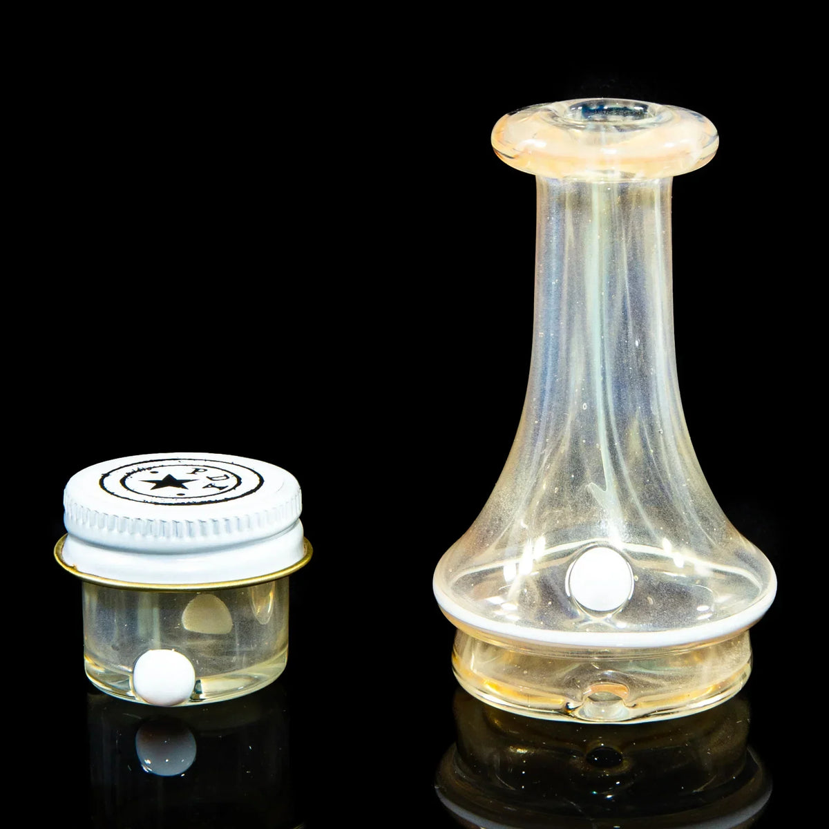 Glass Puffco accessory set with clear jar and opal marble on black background.
