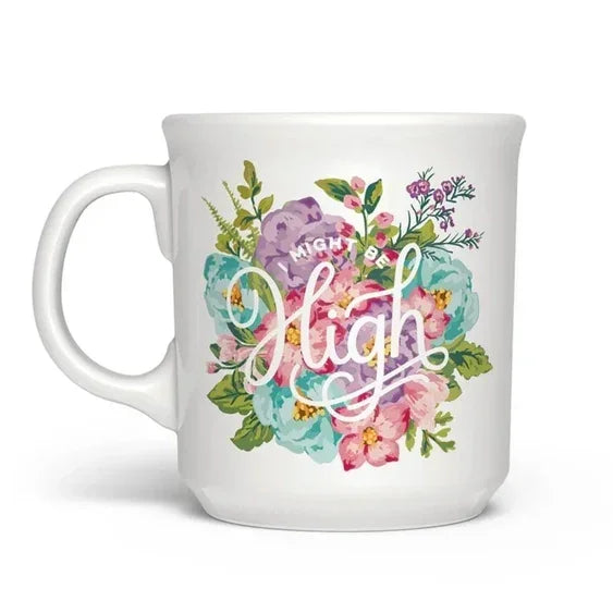 White ceramic mug with colorful floral design and 'Might Be High' text on front.
