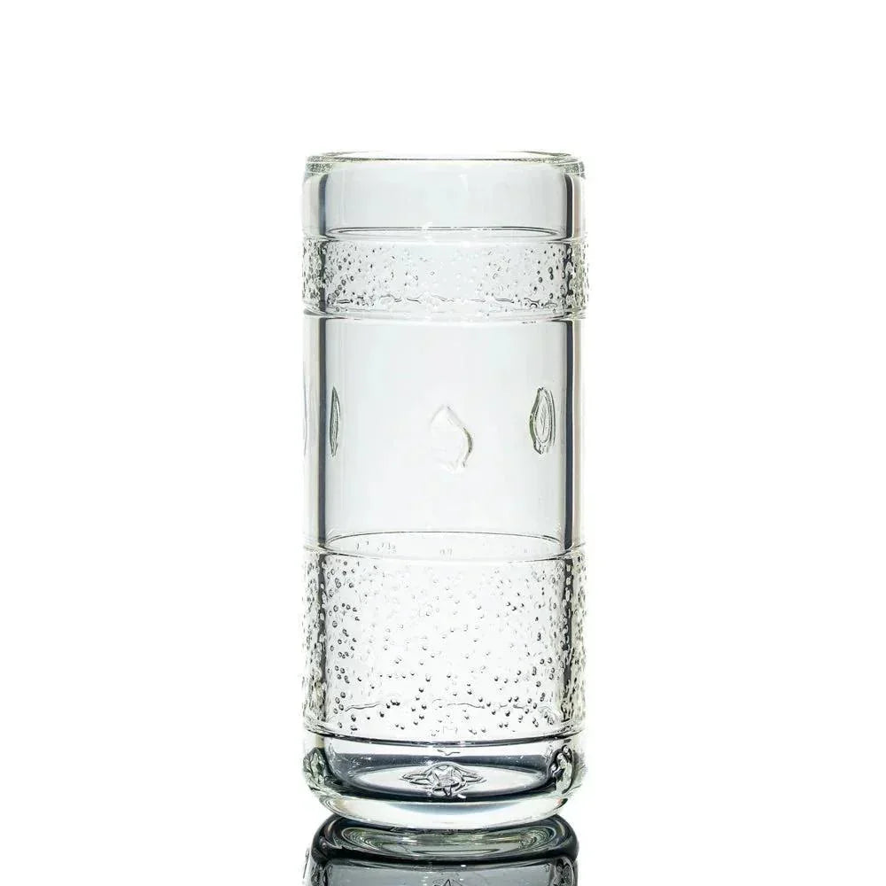 Clear textured glass tumbler with bubble accents on a white background