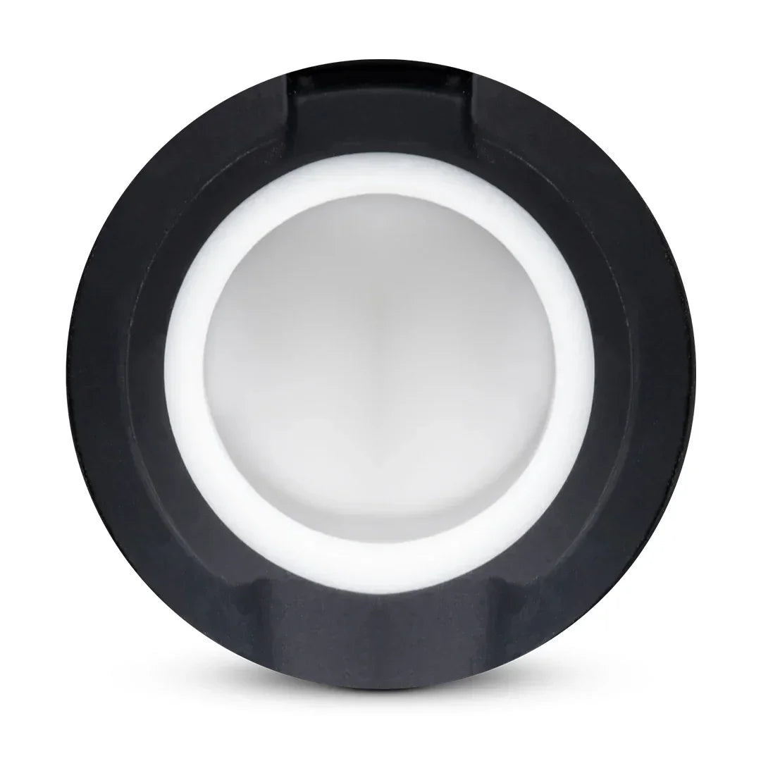 Top view of a white ceramic vaporizer chamber with black outer ring