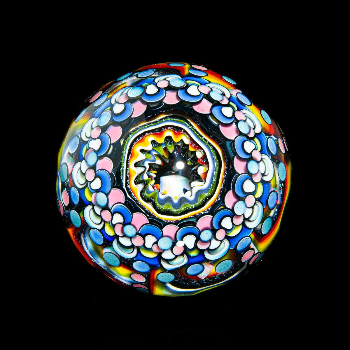 Colorful heady glass marble with intricate swirling patterns and vibrant colors on black background