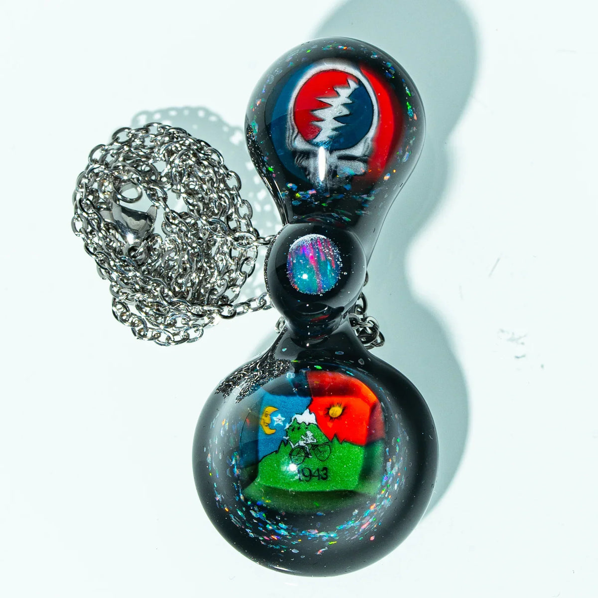 Colorful glass pendant necklace with vibrant designs and chain, heady art glass jewelry