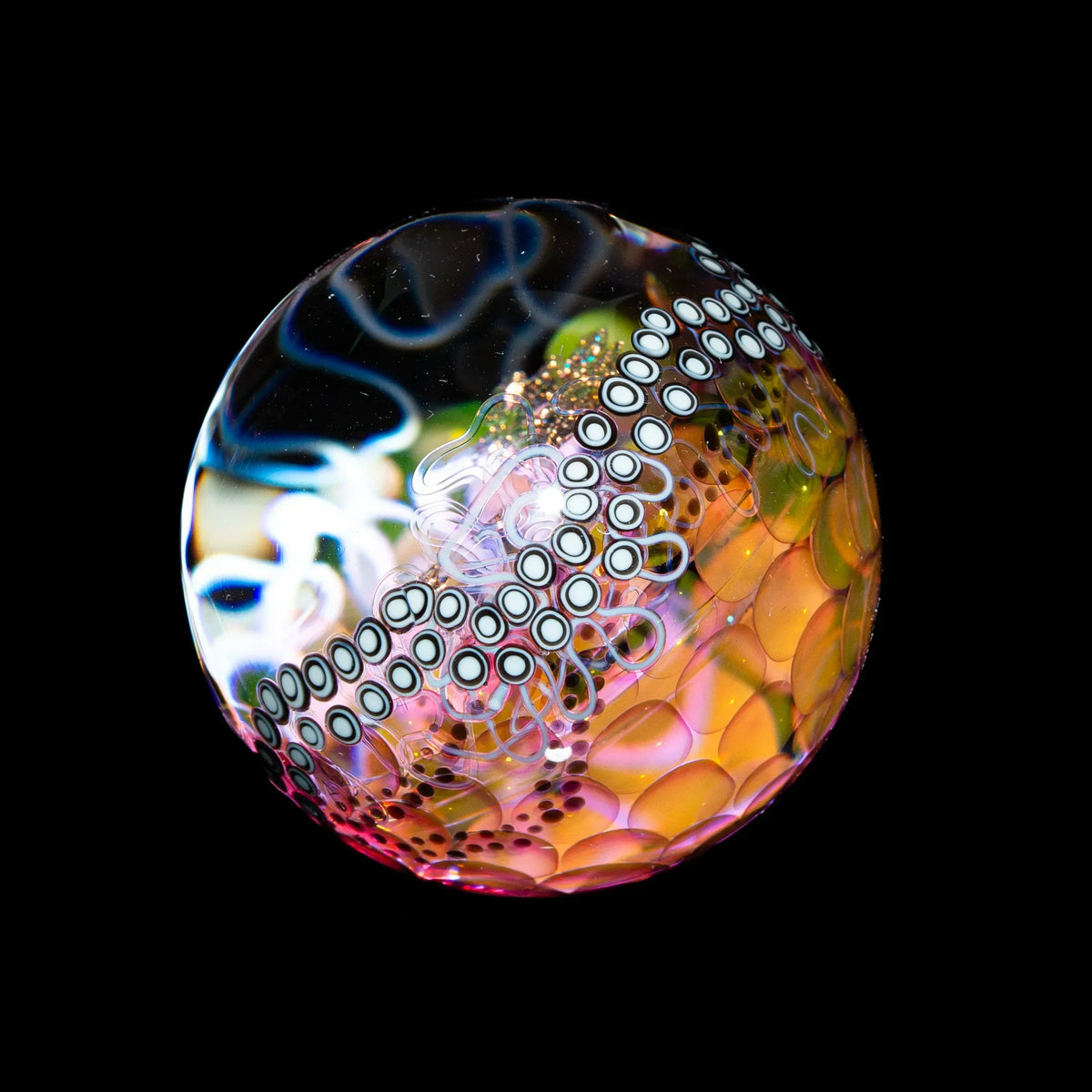 Heady glass marble with intricate patterns, colorful swirls, and dot designs on black background