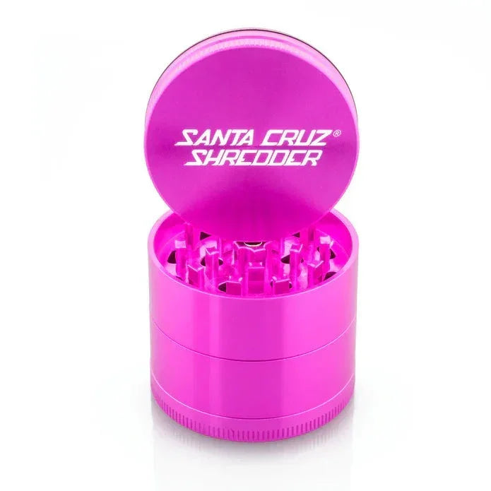 Pink Santa Cruz Shredder aluminum herb grinder with open lid and cutting teeth visible