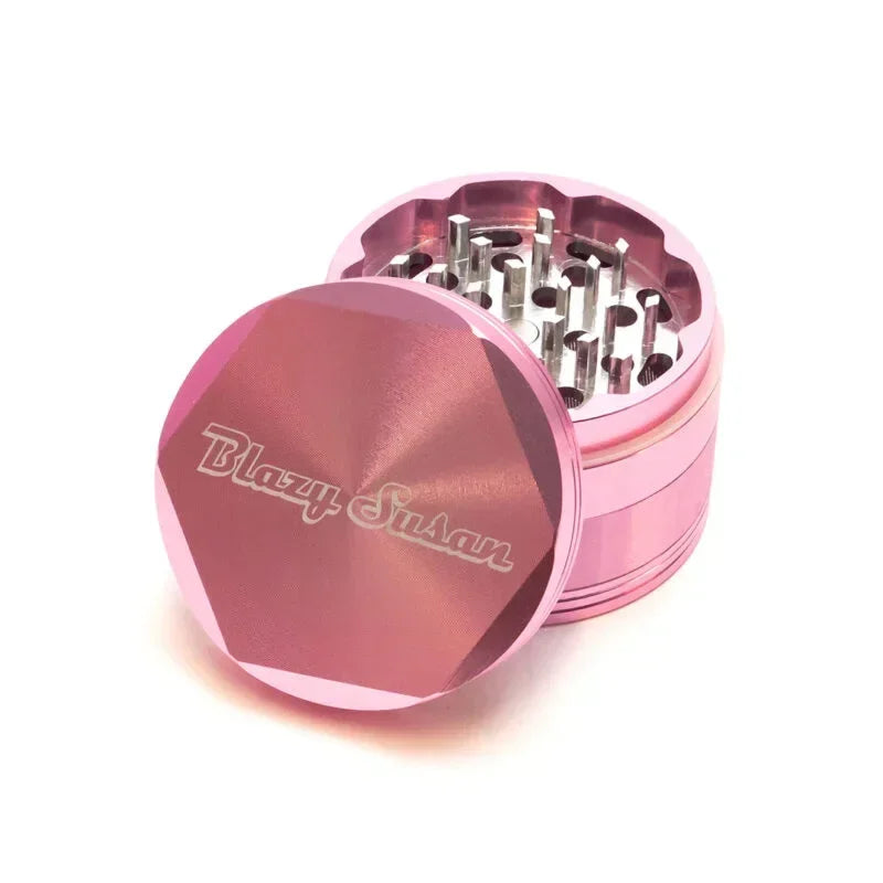 Pink metal herb grinder with diamond-shaped lid and sharp teeth, Blazy Susan engraving