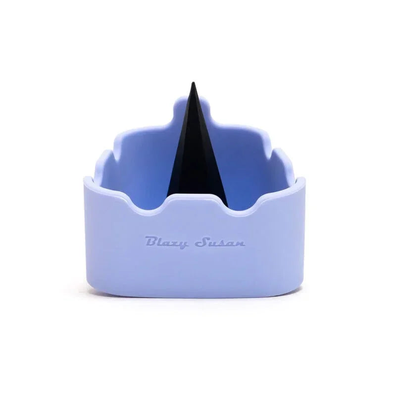Purple silicone ashtray with black spike and wavy edges on a white background