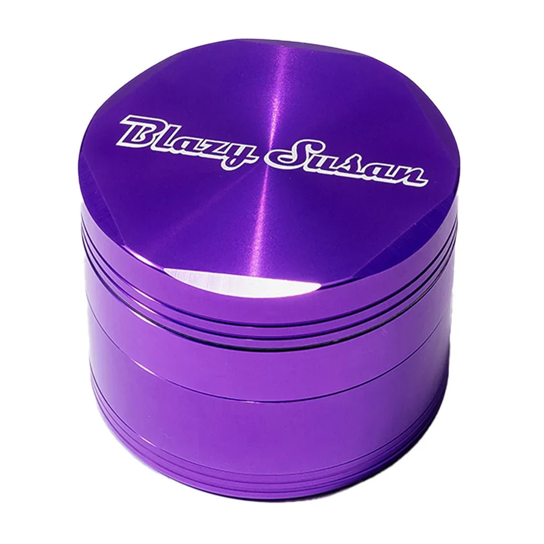Purple metal herb grinder with Blazy Susan logo, smoking accessory