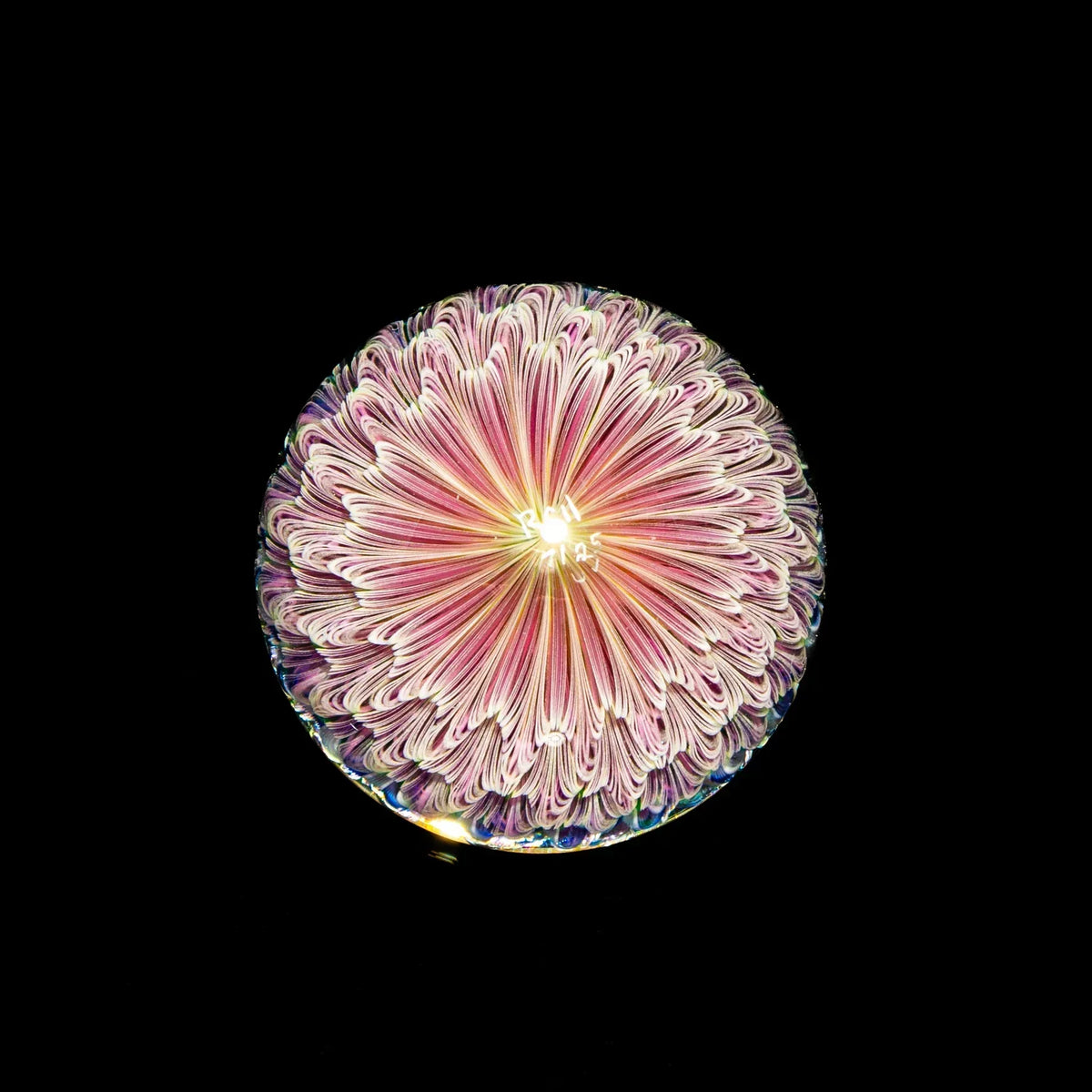 UV-reactive heady glass with intricate pink and white blossom pattern on black background